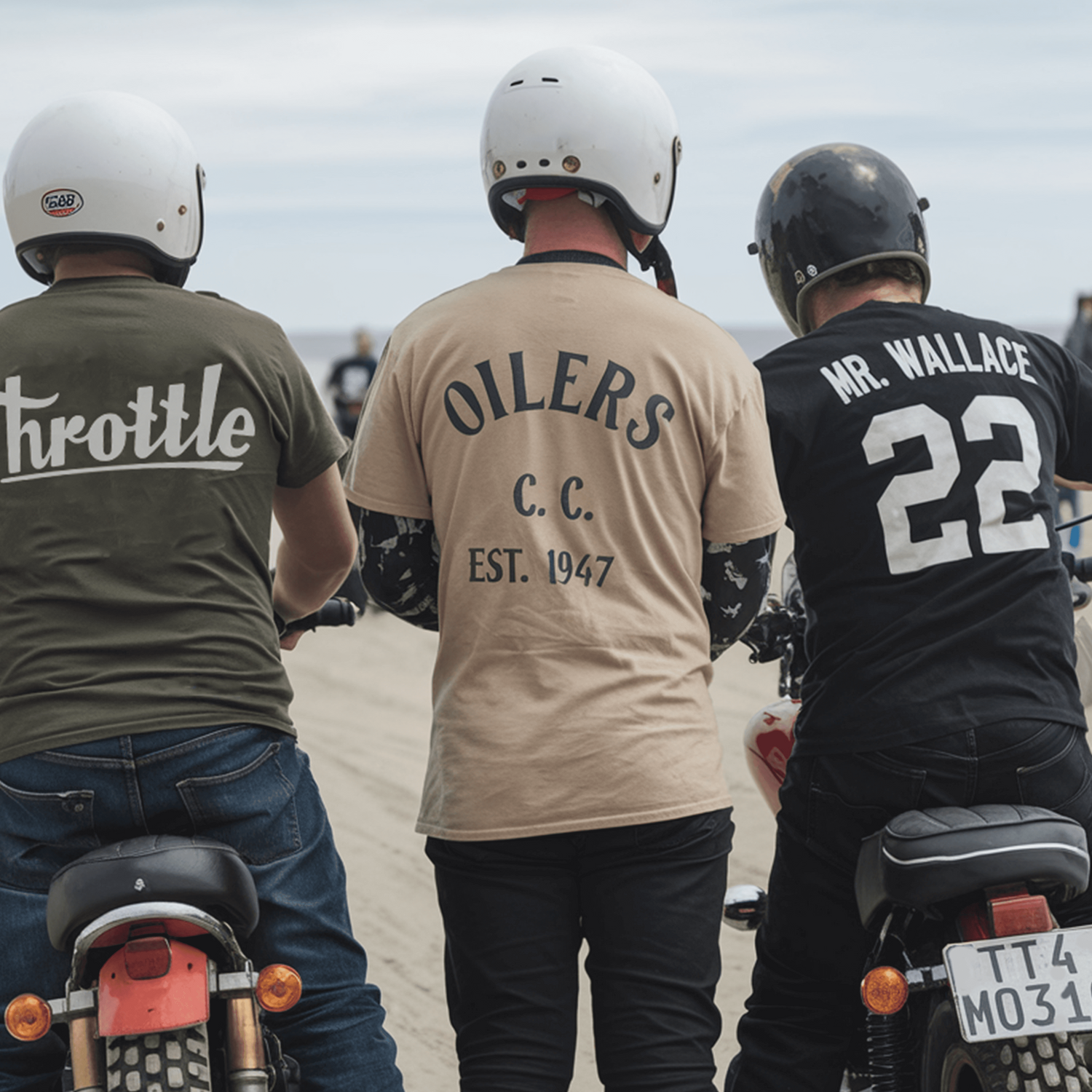 Three motorcyclists with custom shirts and helmets on a dirt road.